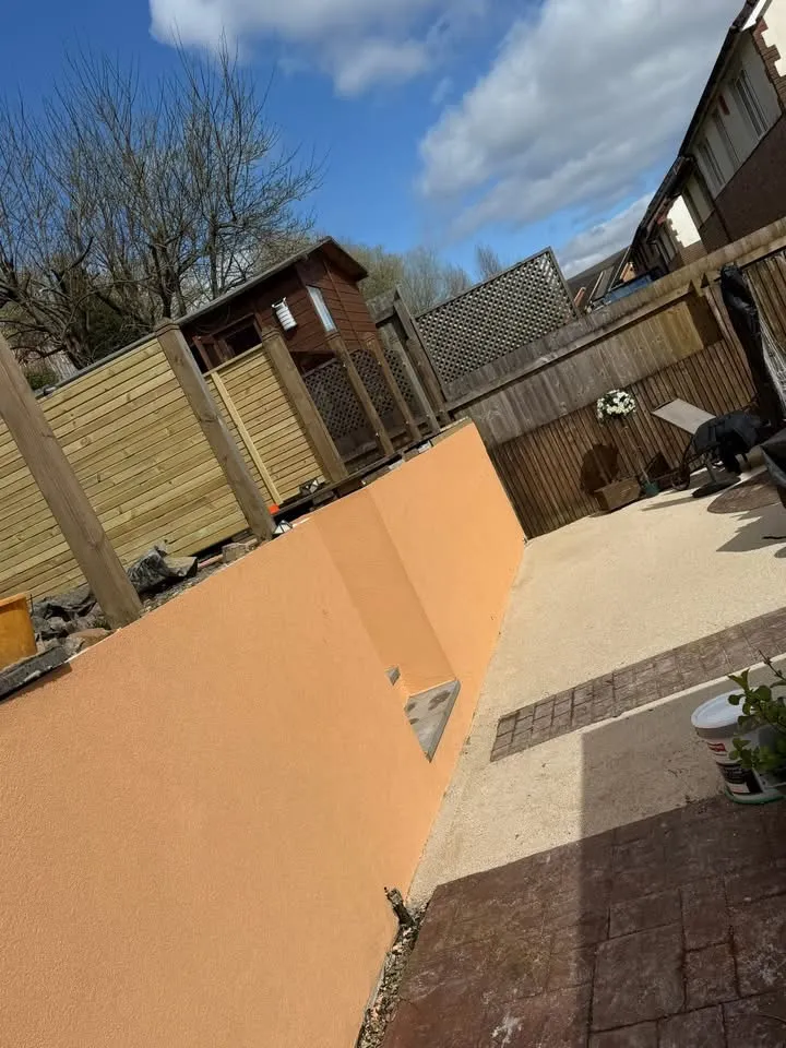 Freshly applied silicone render across the rear elevation of a Porth home